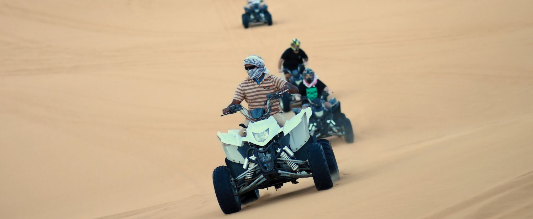 man-riding-quad-bike